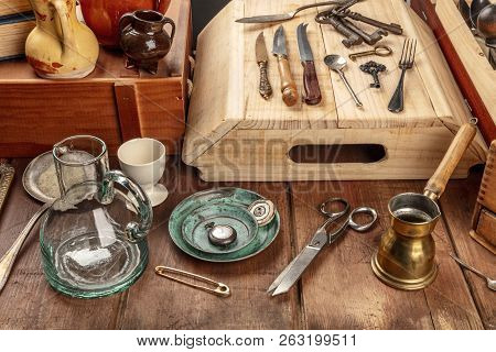 A Photo Of Many Vintage Objects, Flea Market Stuff On A Wooden Table