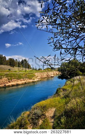 The Corinth Canal connects the Gulf of Corinth with the Saronic Gulf in the Aegean Sea in Greece. It cuts through the narrow Isthmus of Corinth and separates the Peloponnese from the Greek mainland