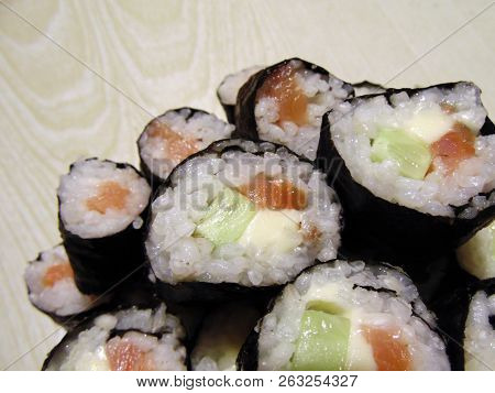 Sushi Rolls Homemade. Plate Lined With Rolls According To Japanese Recipes.