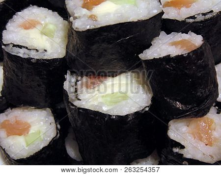 Sushi Rolls Homemade. Plate Lined With Rolls According To Japanese Recipes.