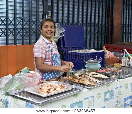 Bangkok, Thailand, 7 Feb,2018: Street Seller Preparing And Selling Food In The Street. Thailandese S