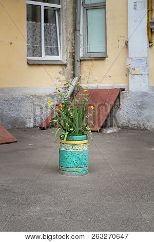 Beautiful City Landscape With A Green Bike Near The Old Wall With Flowers In Drawers In Florence, It