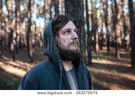 Man Is Standing In The Forest And Just Relaxing Dressed Like Homies In Dark Blue Goodie Downshifting