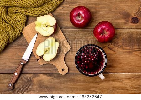 Top View Of Cozy Autumn Morning At Home Breakfast With Cup Of Hot Berries Tea Red Apples Yellow Wool
