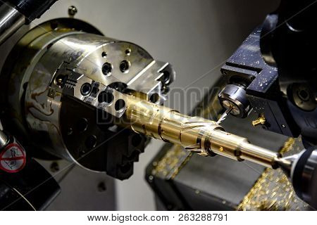 The Cnc Lathe Machine Cutting  The Groove Slot At The Steel Shaft By Milling Spindle .hi-technology 