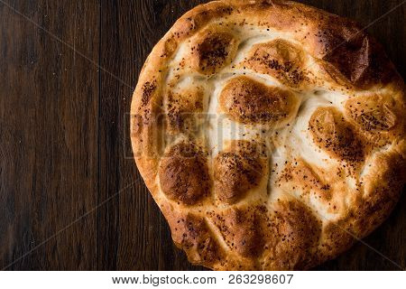 Turkish Ramadan Bread - Ramazan Pidesi On Wooden Surface / Pide