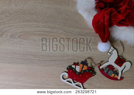 Natural Background, Christmas Toys, A Red Cap. The Concept Of The New Year Celebration. Cropped, Iso