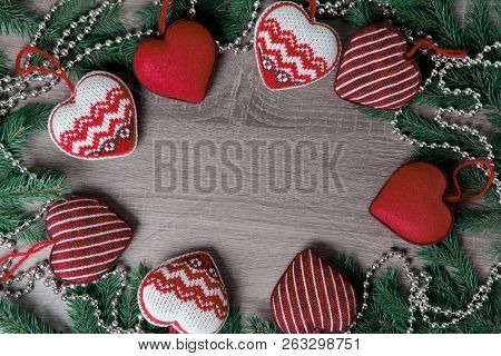 Natural Background, Christmas Toys, Red Hearts. Circle, Green Branches Of Spruce, Beads. The Concept