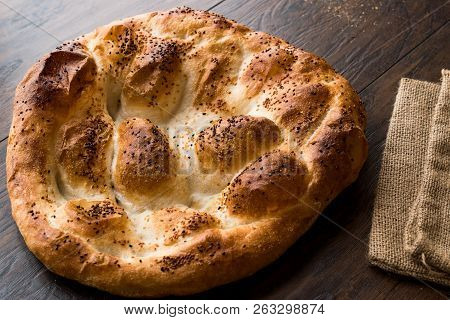 Turkish Ramadan Bread - Ramazan Pidesi On Wooden Surface / Pide