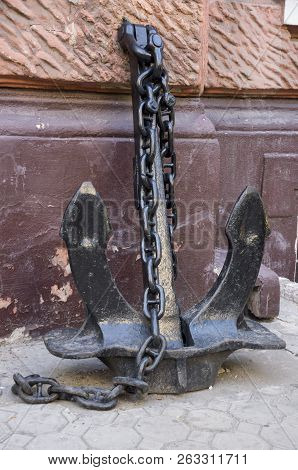 Iron Anchor On The Fence. Metal Skulpture, Street Design