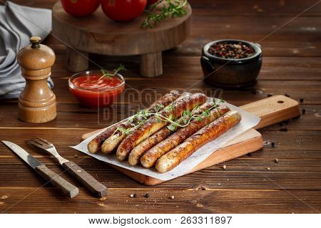 Pork Chipolata. Close-up View Of Fried Sausages. Meat Dish