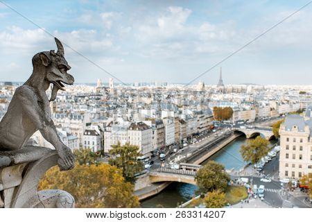 Aerial Panoramic View Of Paris With Gargoyle Sculpture On The Notre-dame Cathedral During The Mornin