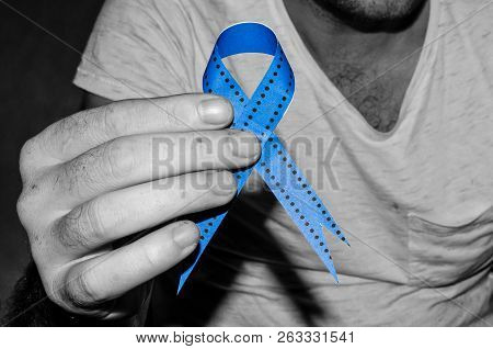 Man Holding A Blue Ribbon, Blue November Concept
