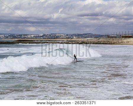 A Surfer With A Happy Atttiude After Catching Is Perfect Wave Of The Moorning On 10/10/2018 In Costa