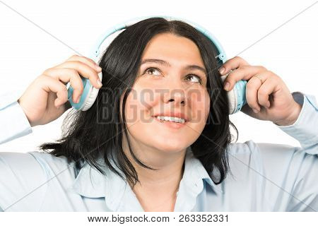 Happy Smiling Brunette Woman With Headphones Listening To Music Isolated On White Background. Liteni