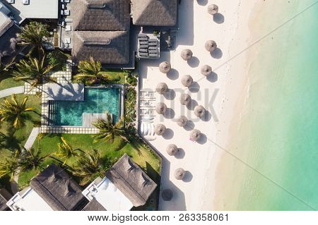 Aerial View Of Amazing Tropical White Sandy Beach With Palm Leaves Umbrellas And Turquoise Sea, Maur