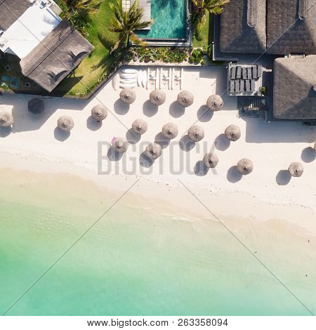 Aerial View Of Amazing Tropical White Sandy Beach With Palm Leaves Umbrellas And Turquoise Sea, Maur