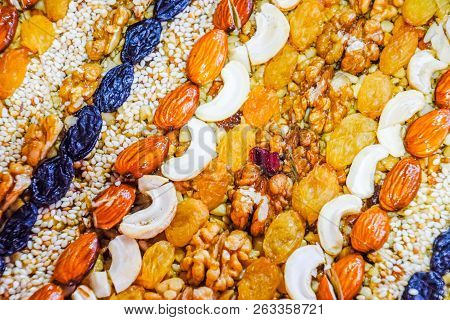 Kozinaki Covered With Nuts And Seeds. Almonds, Cashews And Raisins