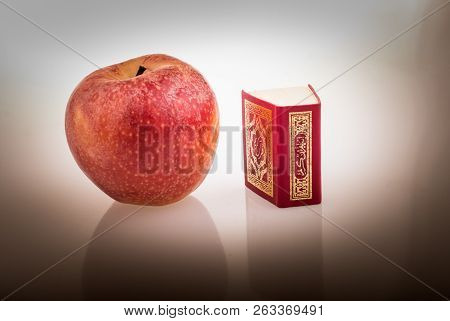 Red Apple And  Islamic Holy Book Quran In Mini Size