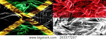 Jamaica Vs Monaco, Monacan Smoke Flags Placed Side By Side. Thick Colored Silky Smoke Flags Of Jamai