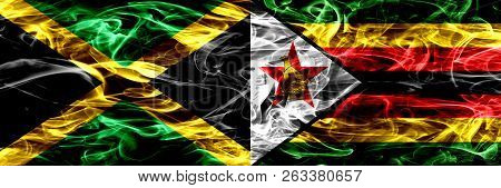 Jamaica Vs Zimbabwe, Zimbabwean Smoke Flags Placed Side By Side. Thick Colored Silky Smoke Flags Of 