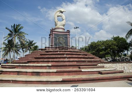 Sculpture Of Dolphins On The Waves Monument In Laem Thaen Cape At Bang Saen Beach In Chonburi, Thail