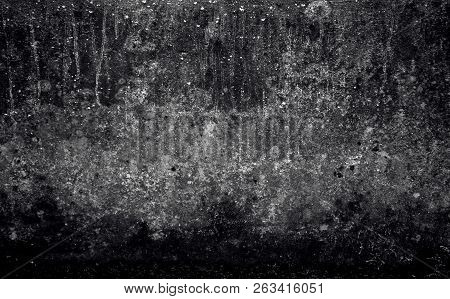Piece Of A Wall Of Black And Gray Shades, On The Surface From The Top, Thin Strains Stretch Downward