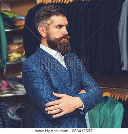 Male Arm In Blue Suit Set. Handsome Stylish Bearded Man Model Posing Wearing Blue Suit. Portrait Of