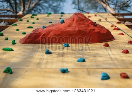 Climbing Gym. Colorful Footholds For Training. Grunge Surface Of An Artificial Rock Climbing Wall Wi