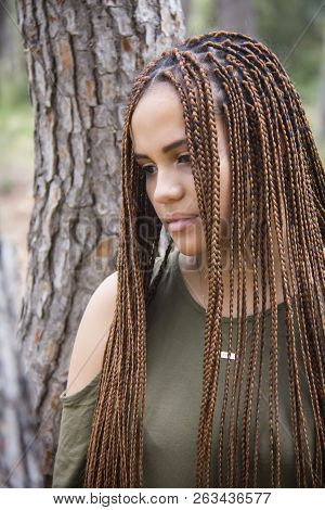 Young And Beautiful Girl With Braided Hair