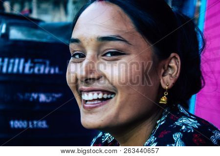 Bandipur Nepal October  15, 2018 Closeup Of Young Woman Seating Front Her House In A Side Street Of 