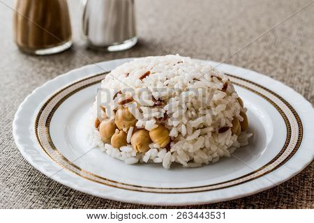 Turkish Rice With Chickpea Served With Salt And Pepper / Nohut Pilav. Traditional Food Concept.