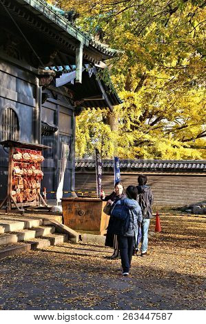 Tokyo, Japan - December 4, 2016: People Visit Yushima Seido Confucian Temple In Tokyo. The Old Templ