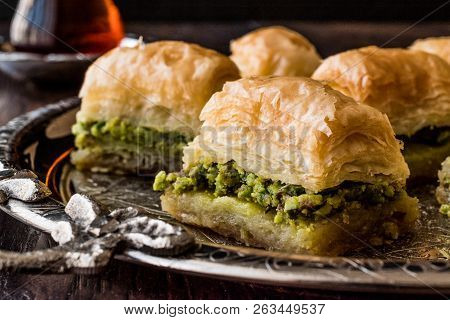 Turkish Dessert Baklava With Tea On Silver Tray. Desset Concept.
