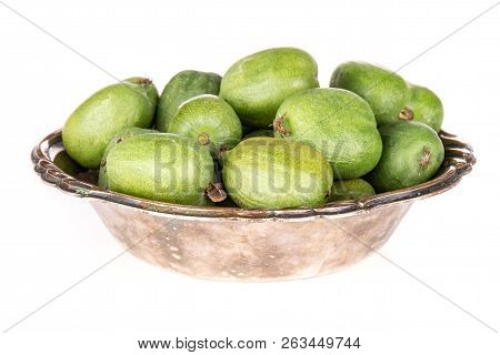 Lot Of Whole Fresh Green Mini Baby Kiwi Fruit In Old Iron Bowl Isolated On White Background