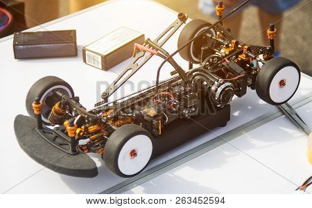 Automobile Sport, A Participant Prepares His Electric Car To Compete For Car Racing, Close-up, Radio