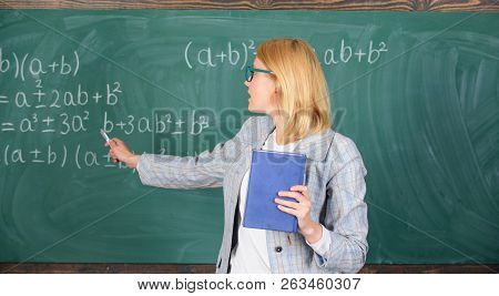 What Makes Great Teacher. Teacher Smart Woman With Book Explain Topic Near Chalkboard. School Teache