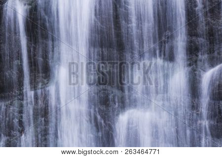 A Waterfall Flowing Over A Rock Wall At Burr Pond State Park In Torrington Connecticut.