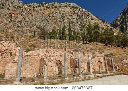 The Temple Of Apollo At Delphi, Greece In A Summer Day.