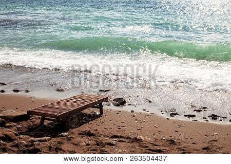 Beach Chair By The Ocean. Vacation In The Tropics