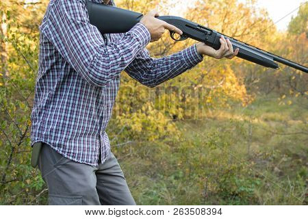 Male With Semi-automated Shotgun In The Autumn Forest Ready To Hunting, Close Up View