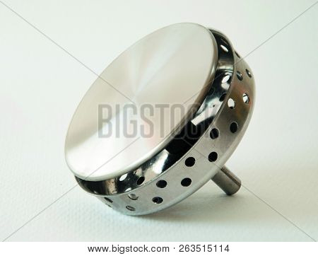 Metallic And Shiny Stopper Of A Sink For Being New.