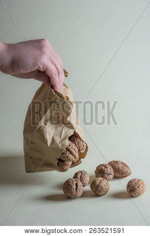 Woman Holding A Damaged Paper Bag