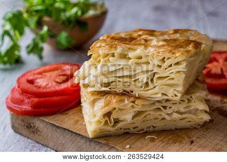 Su Boregi / Turkish Patty With Greens And Tomatoes.