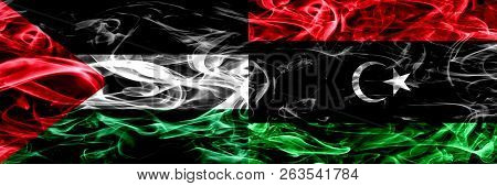 Palestine Vs Libya, Libyan Smoke Flags Placed Side By Side. Thick Colored Silky Smoke Flags Of Pales