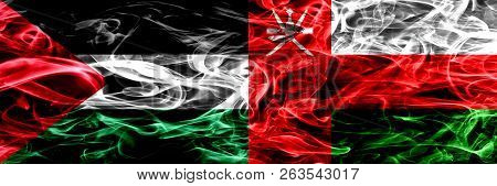 Palestine Vs Oman, Omani Smoke Flags Placed Side By Side. Thick Colored Silky Smoke Flags Of Palesti