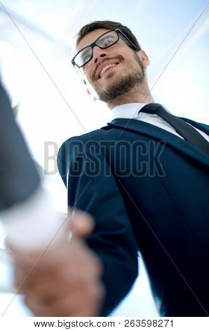 close up of business handshaking from below