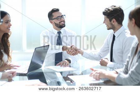 business partners discussed the terms of the contract at a worki