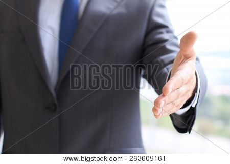Unknown Business Man Offering Handshake While Standing Straight. Success Cooperation And Agreement C
