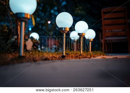 Solar Lamps In The Garden In Autumn